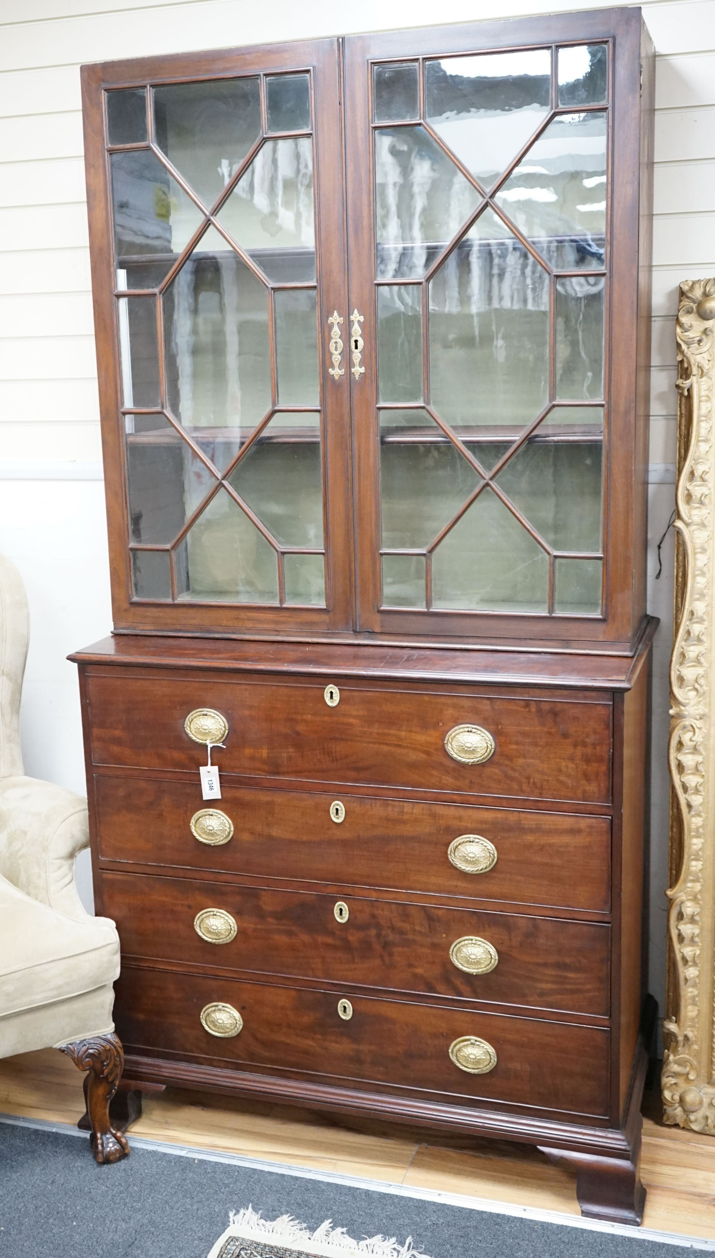 A George III mahogany secretaire bookcase, lacking cornice, width 110cm, depth 58cm, height 216cm